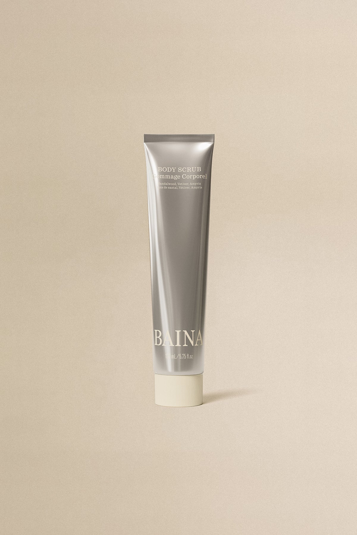 BAINA body scrub and body wash in a clear container with exfoliating beads, designed for smooth, refreshed skin.