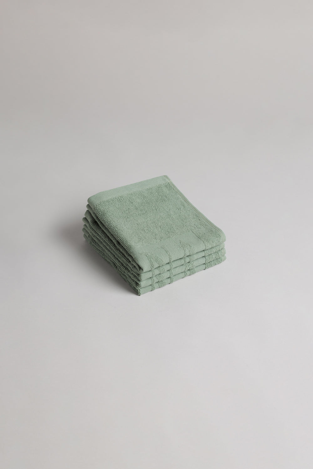 BAINA Agnes face cloth in sage green, soft and absorbent cotton washcloth for gentle facial cleansing.