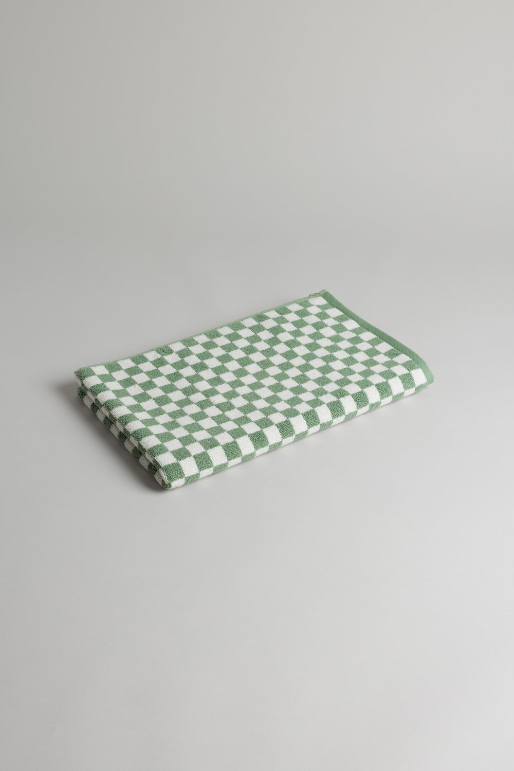 BAINA Beppu bath mat in sage and chalk colors, soft textured rug for bathroom decor and comfort.