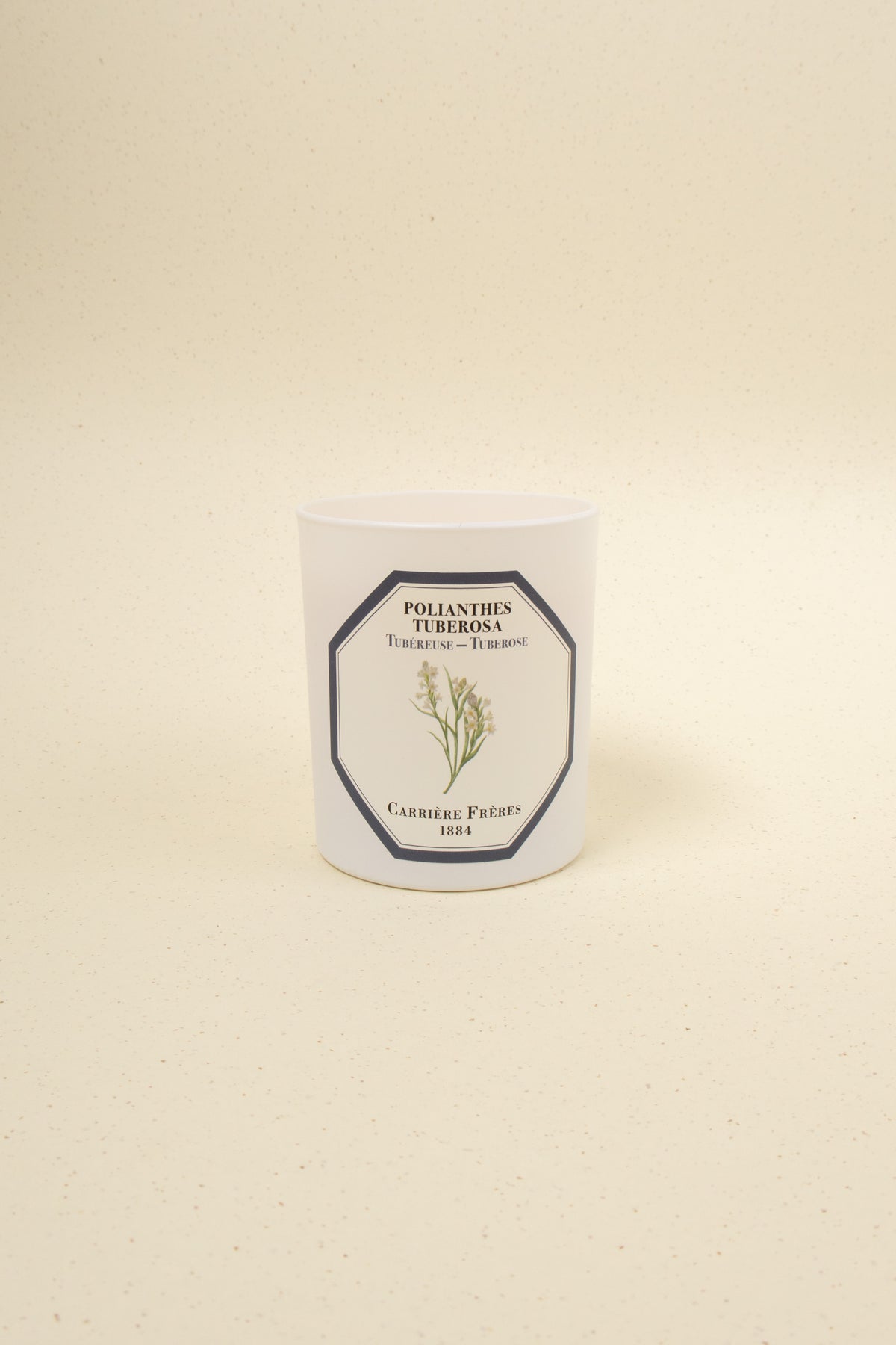 Tuberose scented candle by Carrière Frères with a simple glass jar and white wax, showcasing elegant floral-inspired design.