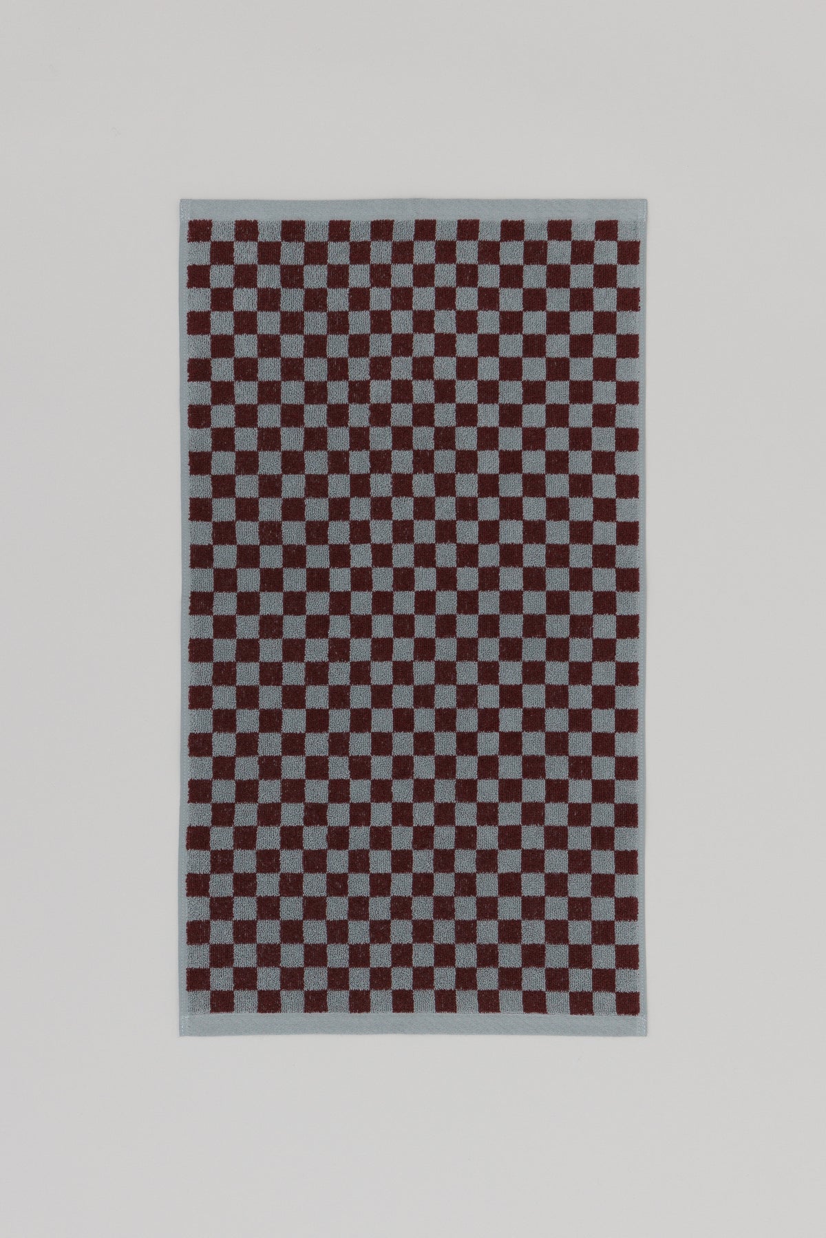 Baina Josephine hand towel in Cement and Rhus color, flat lay showcasing soft, textured cotton fabric for bathroom or kitchen use.