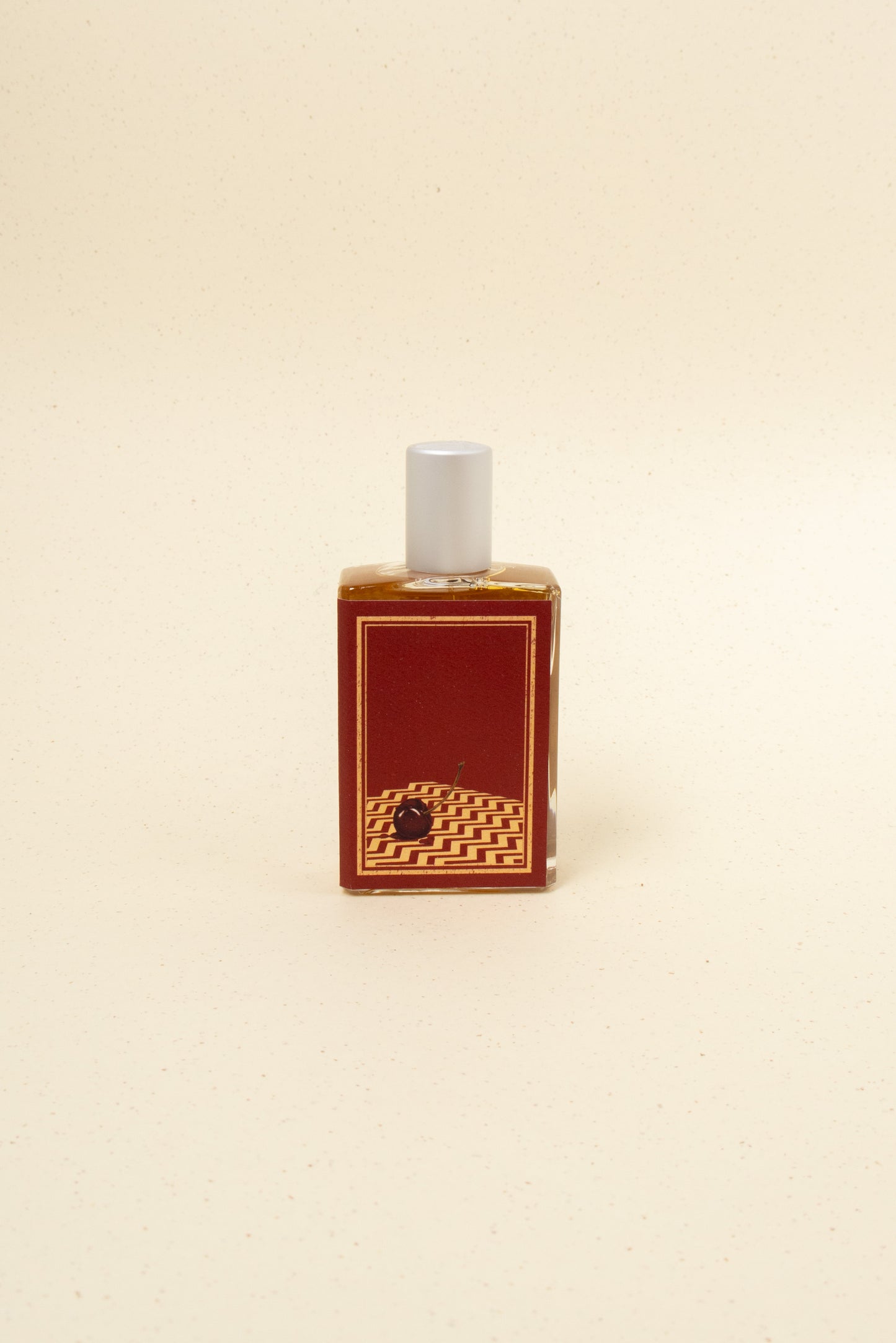 Imaginary Authors A Little Secret perfume bottle with elegant packaging and floral accents.