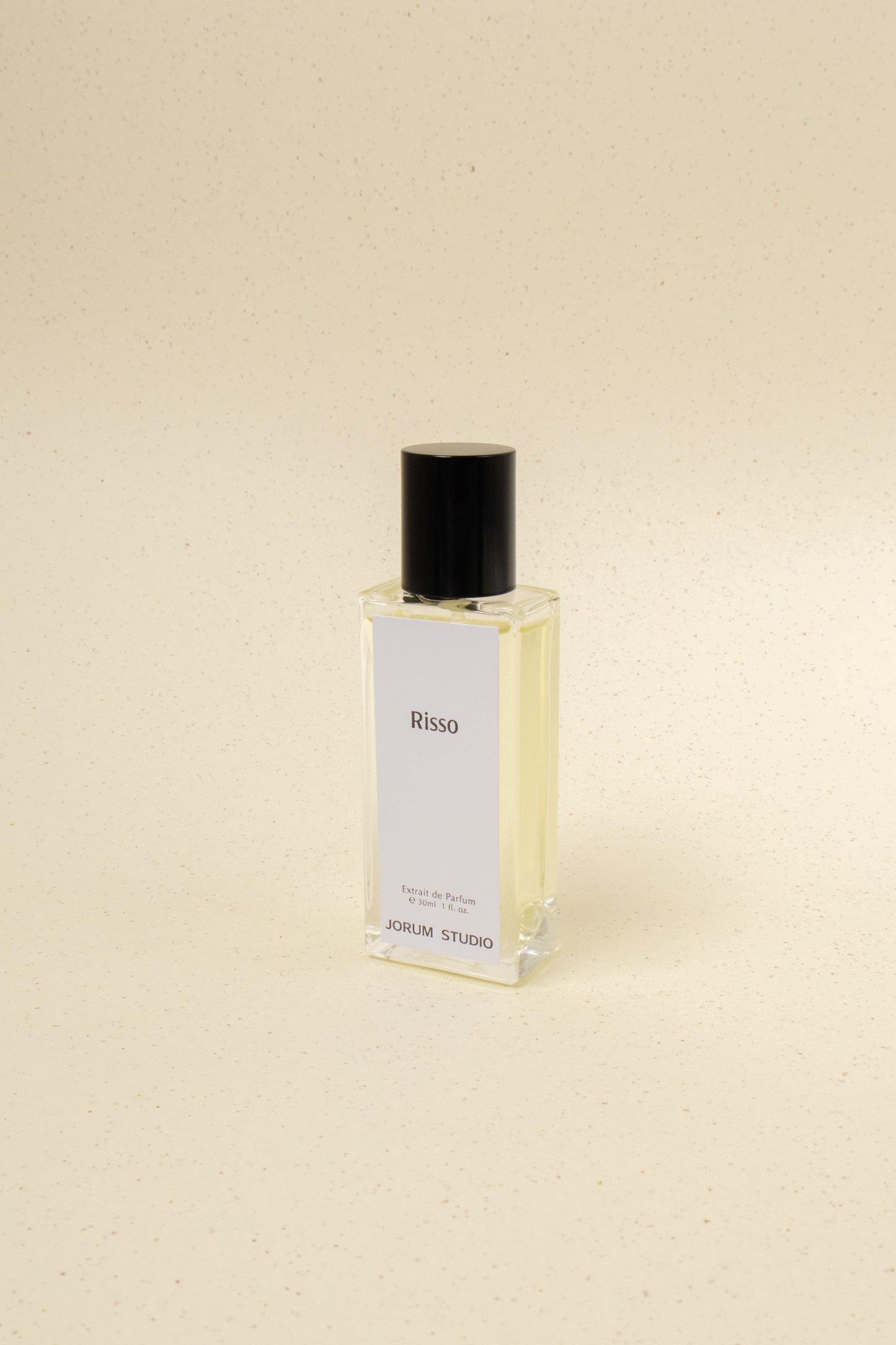 Jorum Studio Risso perfume bottle with sleek design and minimalist label, displayed on a neutral background.