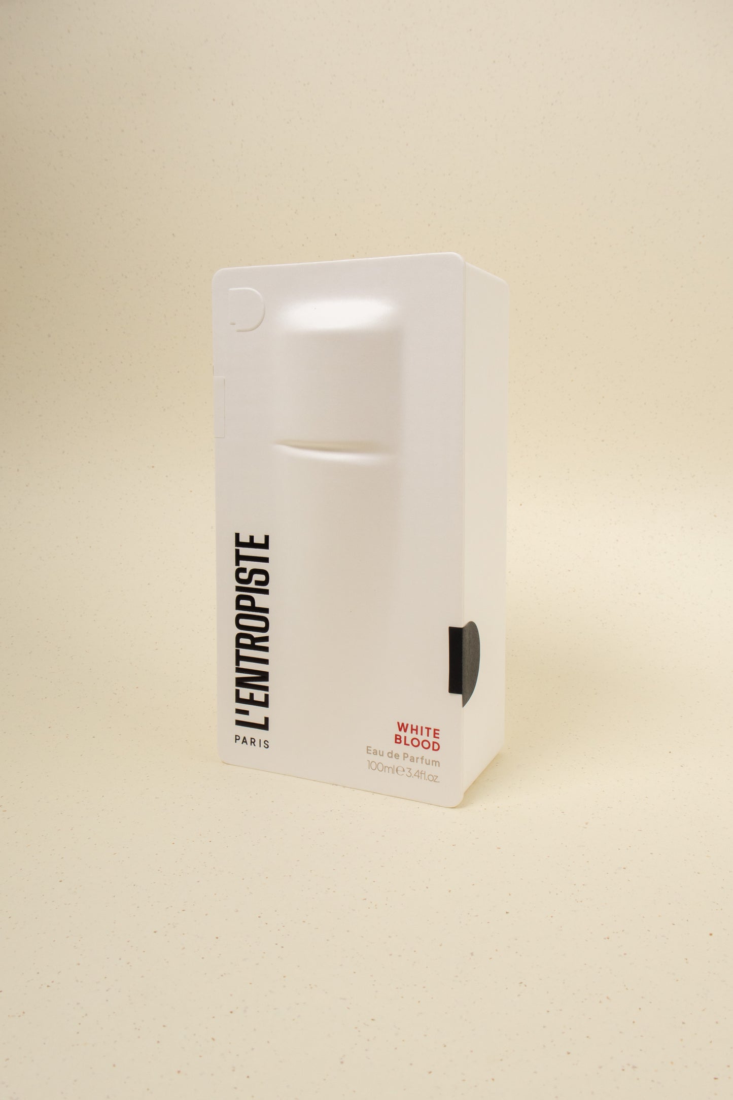 L'Entropiste White Blood perfume bottle with sleek white design and minimalist label, showcasing elegant branding.