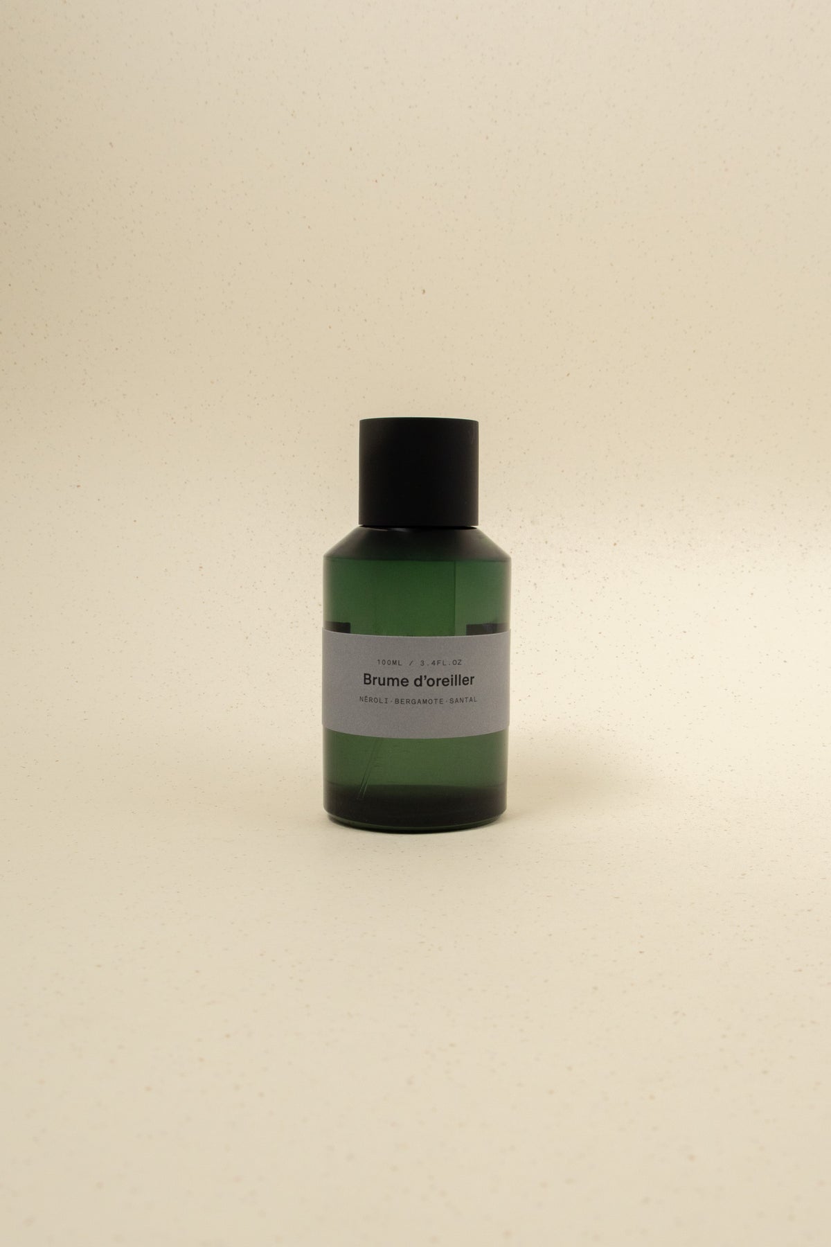 MarieJeanne Brume d'Oreiller perfume spray bottle, soothing pillow mist with floral and calming scent, in elegant packaging.