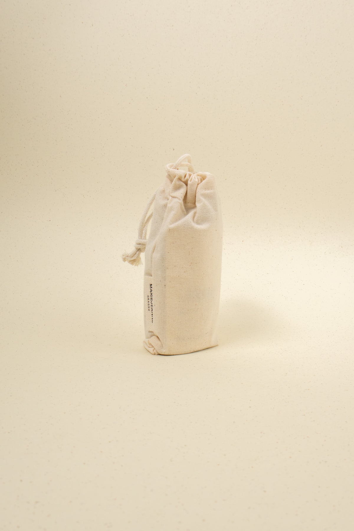 MarieJeanne Brume d'Ete perfume spray, featuring a sleek bottle design with a refreshing summer fragrance.