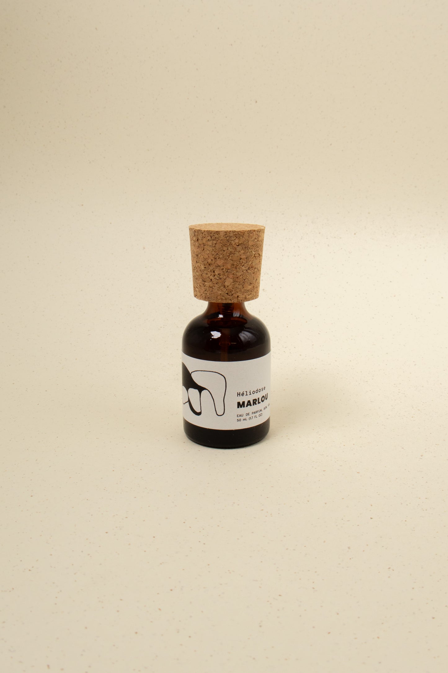Marlou Héliodose perfume bottle with elegant design, featuring a sleek glass container and a sophisticated cap.