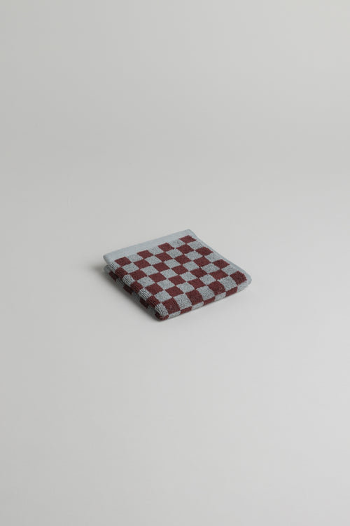 Baina Quill face cloth in cement color, made of soft, absorbent fabric, ideal for gentle cleansing and facial skincare.