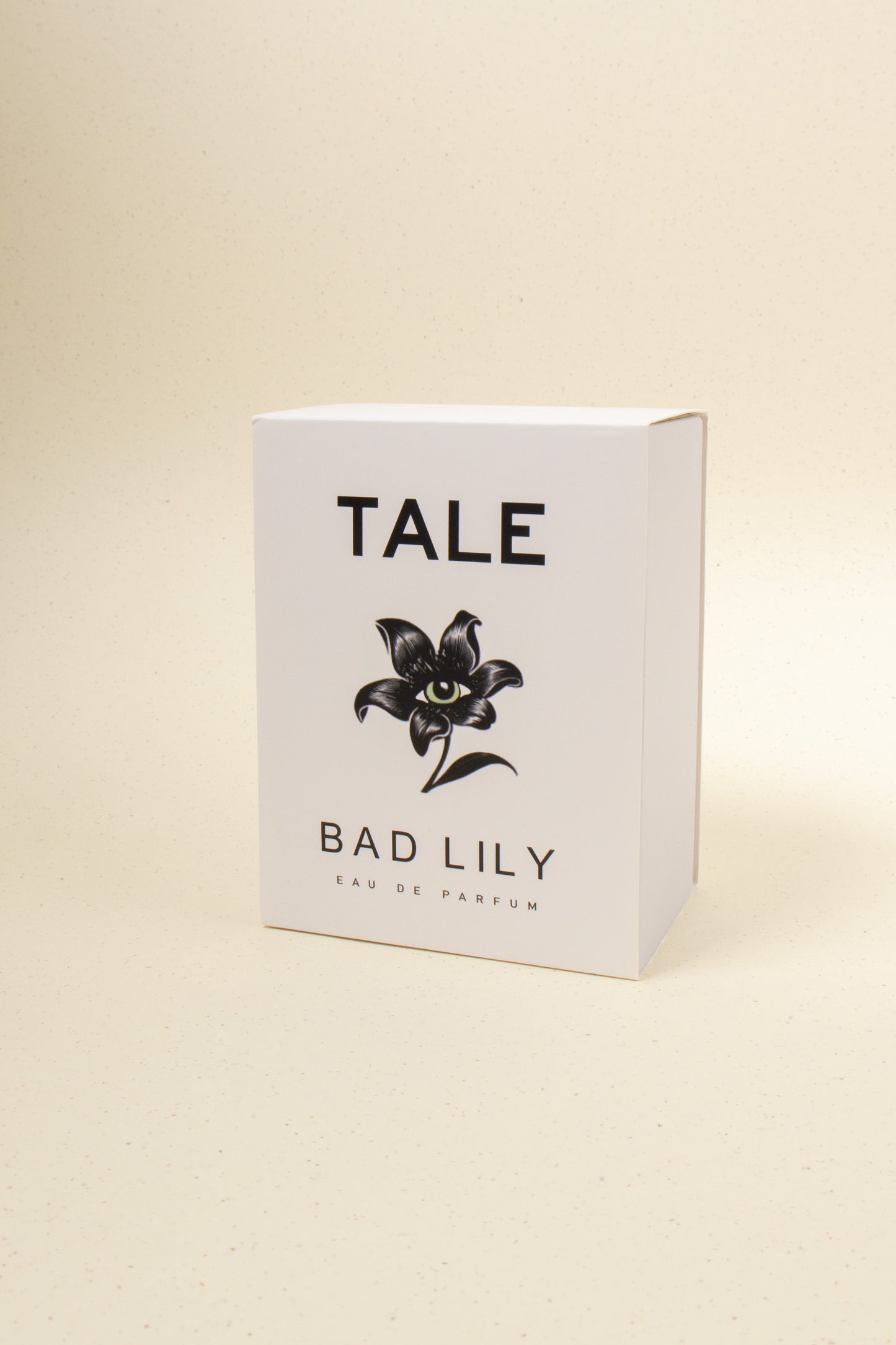 TALE Bad Lily perfume bottle with floral design, showcasing the elegant packaging and sleek shape of the fragrance.
