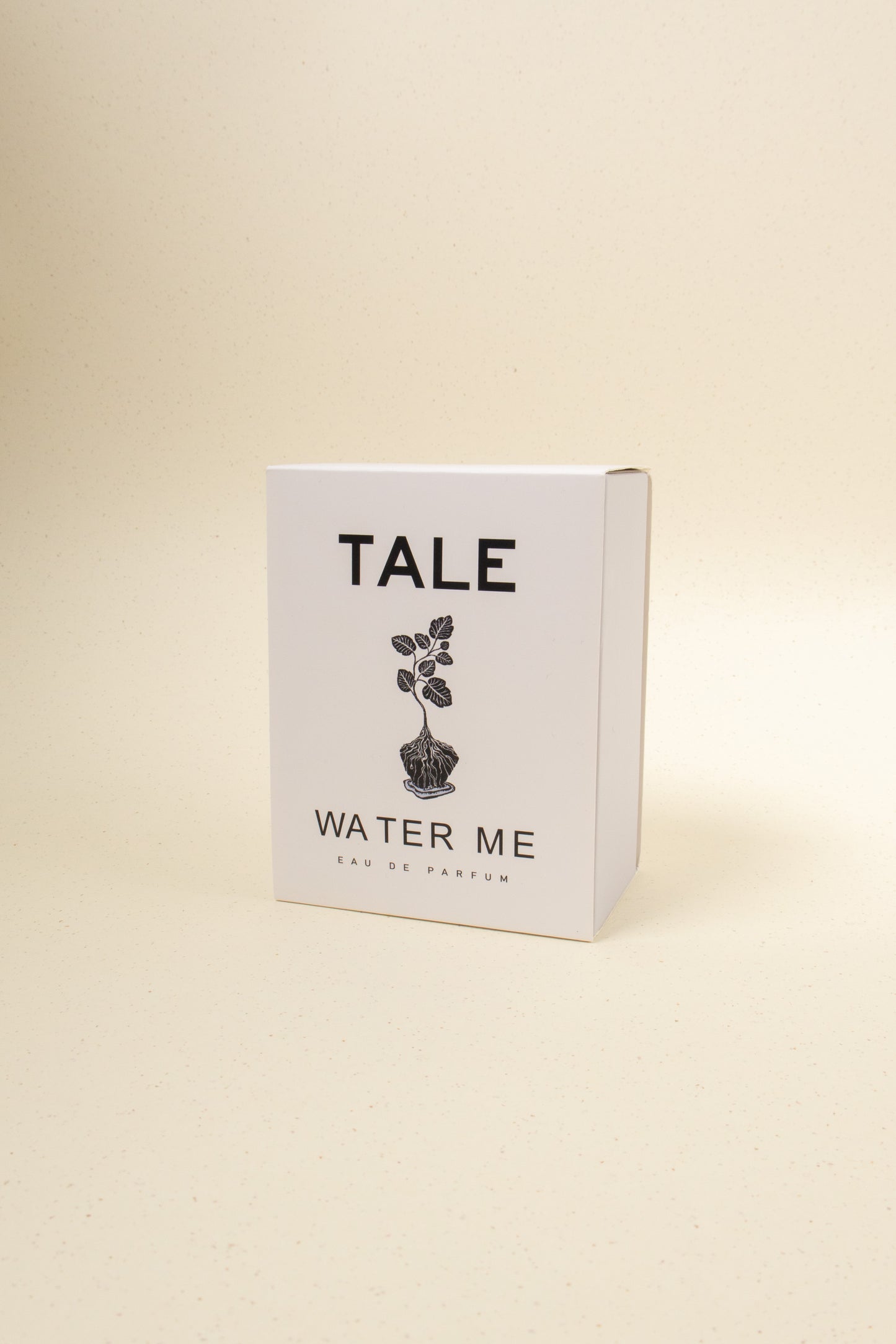 TALE Water Me perfume bottle featuring a sleek design and clear glass with a silver cap, displayed against a neutral background.