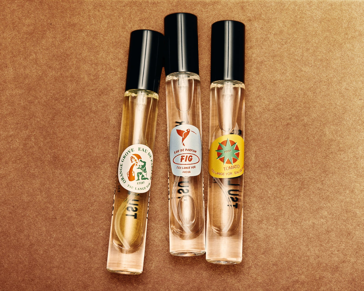 Tsu Lange Yor The Garden perfume bottle with floral and green accents, elegant design, and clear glass showcasing the fragrance.