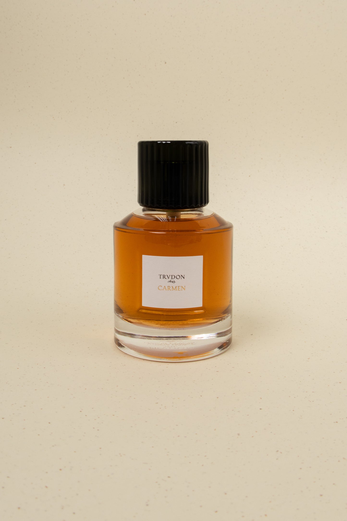 Trudon Carmen perfume bottle with elegant design and label, showcasing the luxurious fragrance product.